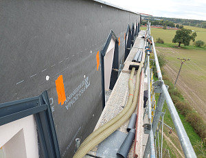 Zateplení bytového domu pomocí foukané izolace